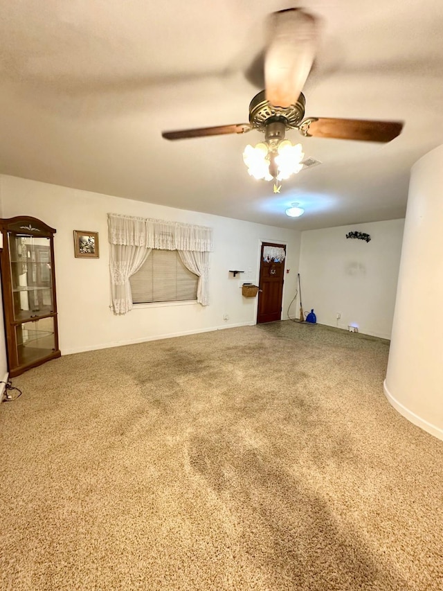 unfurnished living room with ceiling fan