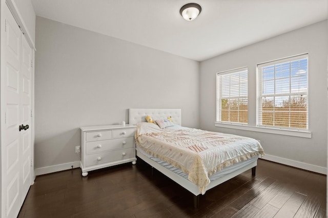 bedroom featuring dark hardwood / wood-style flooring