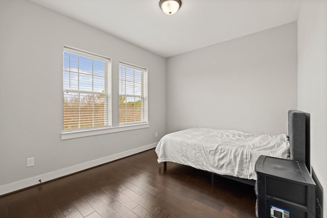 bedroom featuring dark hardwood / wood-style flooring