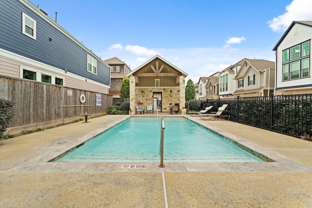 view of pool featuring a patio area