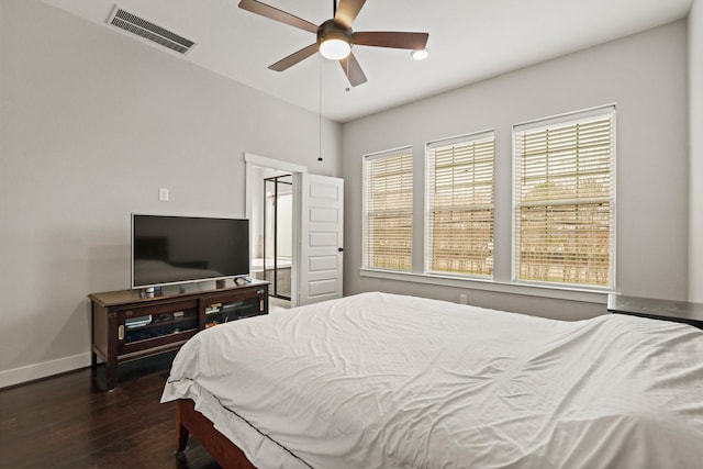 bedroom featuring dark hardwood / wood-style flooring and ceiling fan