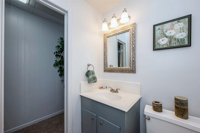 bathroom with toilet and vanity