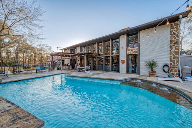 view of swimming pool featuring fence, a patio, and a fenced in pool