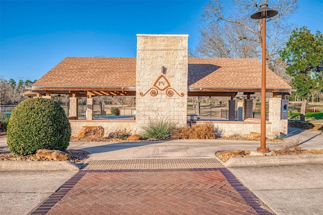 view of property with fence