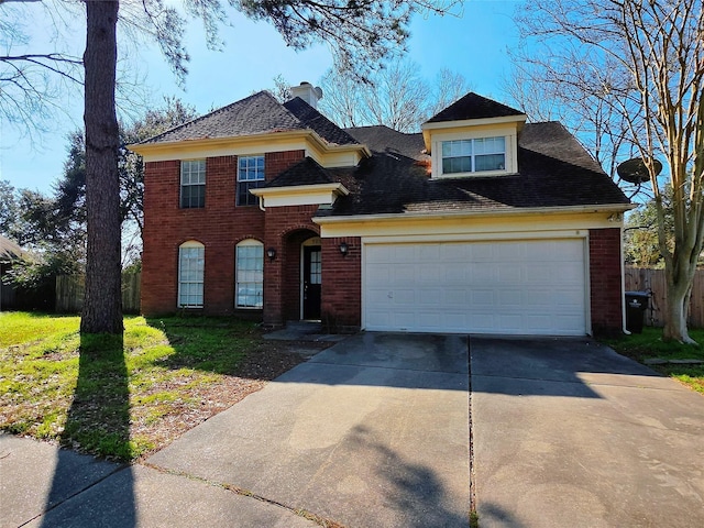 view of front of home with a front yard and a garage