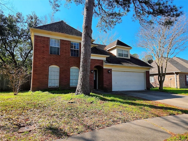 view of front facade featuring a front yard and a garage