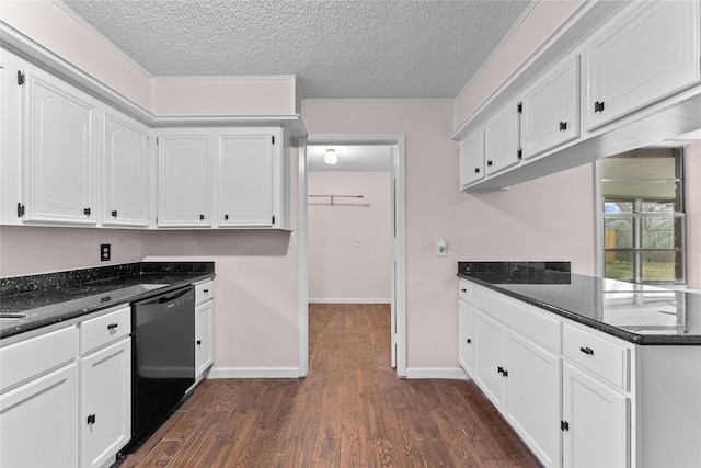 kitchen with white cabinets, dark stone counters, and black dishwasher