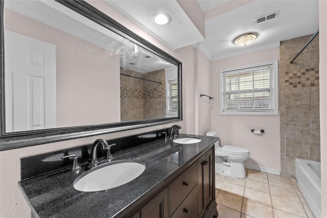 full bathroom with tiled shower / bath, toilet, tile patterned floors, ornamental molding, and vanity