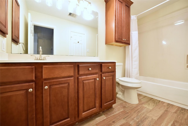 full bathroom with hardwood / wood-style flooring, vanity, toilet, and shower / bathtub combination with curtain