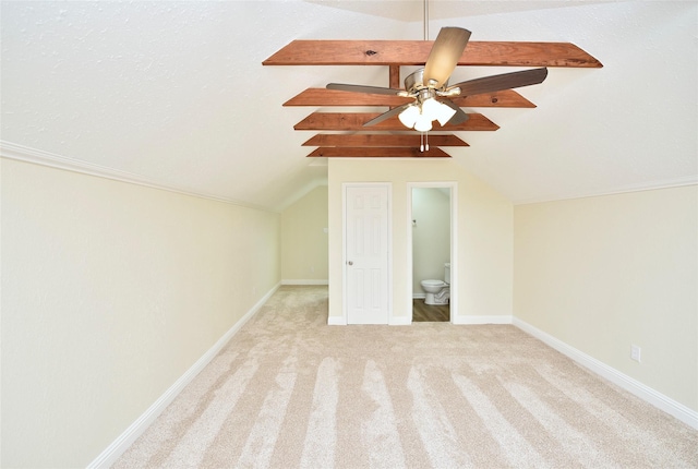 bonus room featuring light carpet, lofted ceiling, and ceiling fan