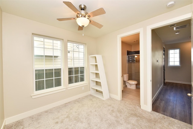 carpeted empty room with ceiling fan