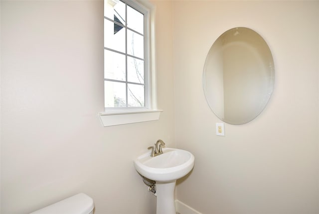 bathroom featuring sink and toilet