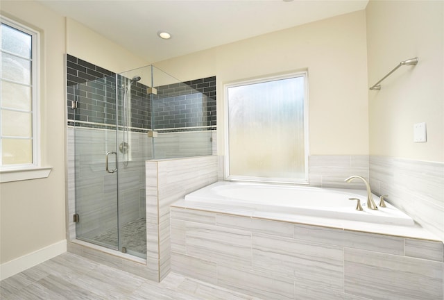 bathroom featuring plus walk in shower