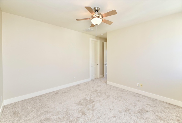 empty room with light carpet and ceiling fan