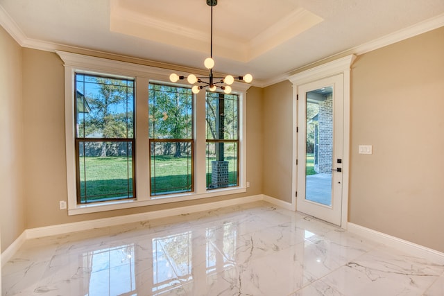 doorway to outside featuring a tray ceiling, a chandelier, and crown molding