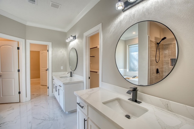 bathroom with ornamental molding, vanity, and walk in shower