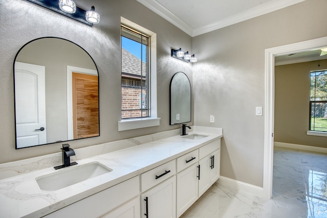 bathroom with ornamental molding and vanity