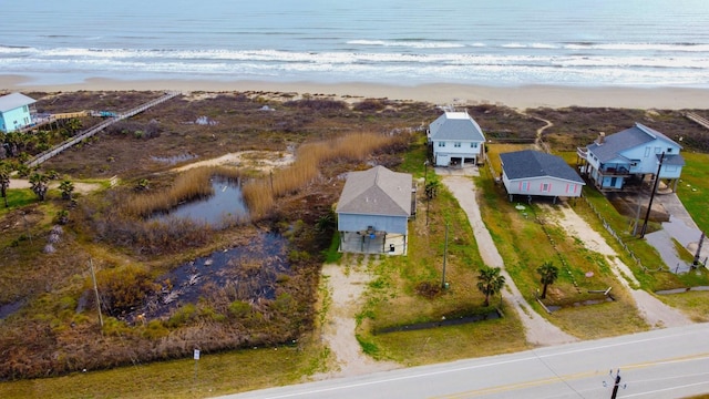 aerial view featuring a water view and a view of the beach