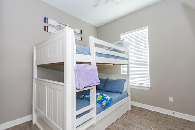 bedroom featuring hardwood / wood-style floors and ceiling fan