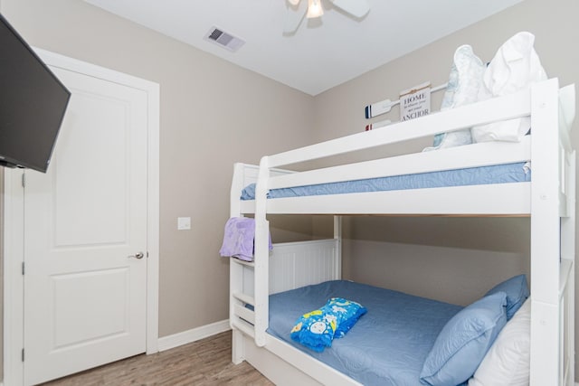 bedroom featuring ceiling fan and wood-type flooring