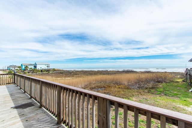 wooden deck featuring a water view