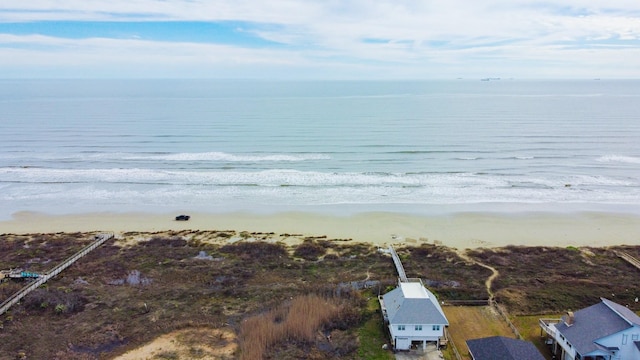 aerial view with a water view and a view of the beach