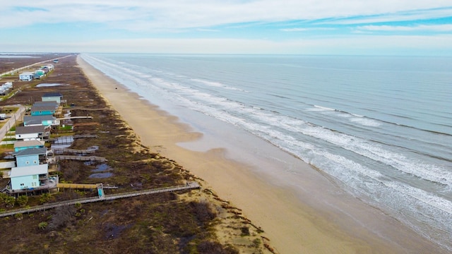 aerial view with a water view and a view of the beach