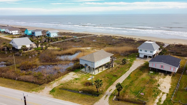 bird's eye view with a water view and a view of the beach