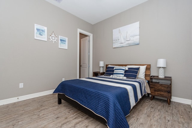 bedroom featuring wood-type flooring