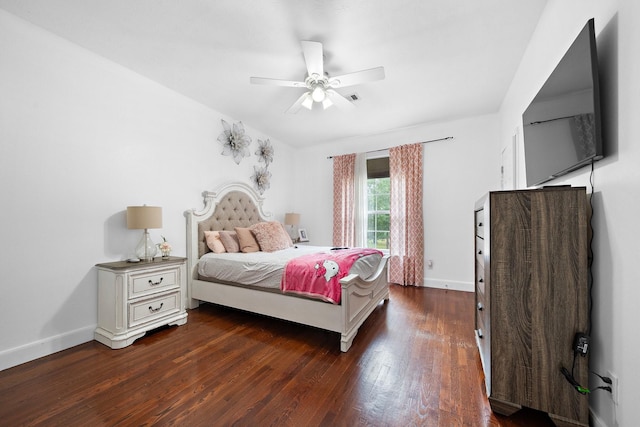 bedroom with dark wood-style flooring, ceiling fan, and baseboards