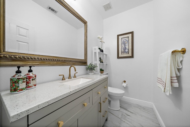 bathroom with toilet, marble finish floor, visible vents, and baseboards