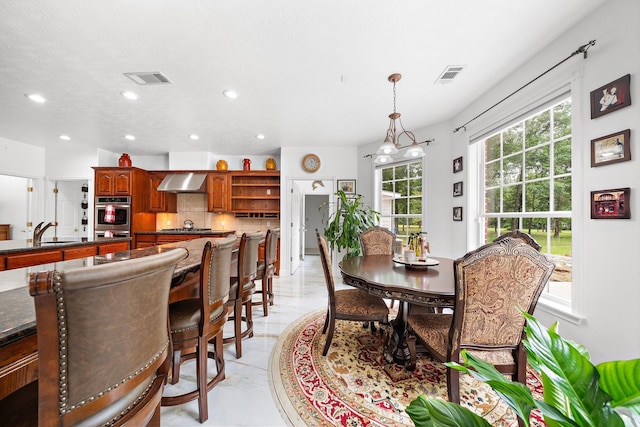 dining space with visible vents and recessed lighting