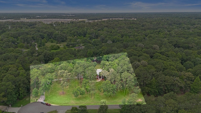 drone / aerial view featuring a view of trees