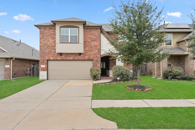 view of property with a front lawn and a garage