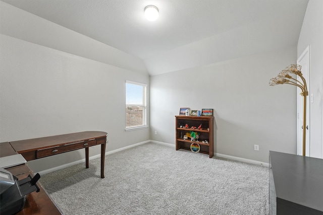 office space with vaulted ceiling and carpet floors