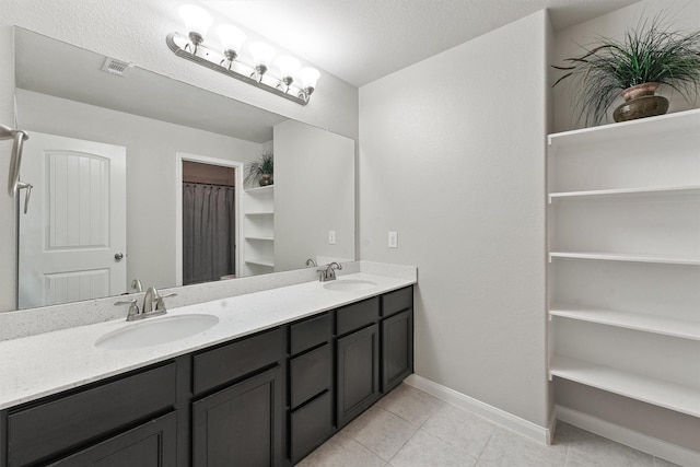 bathroom with vanity and tile patterned floors