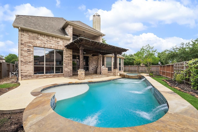 view of pool featuring an in ground hot tub, pool water feature, a pergola, and a patio