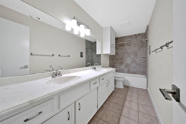 full bathroom featuring tile patterned flooring, double vanity, toilet, and a sink