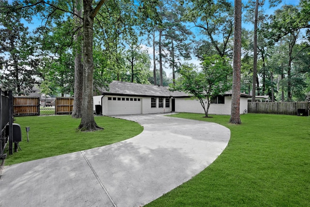 view of front of house featuring brick siding, a front lawn, a garage, and fence