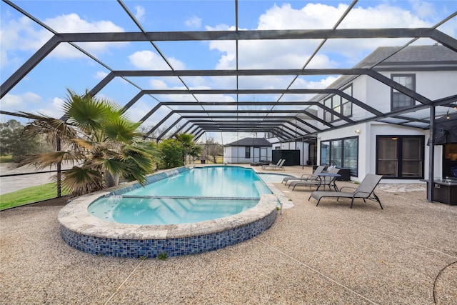 view of swimming pool with a patio area and glass enclosure