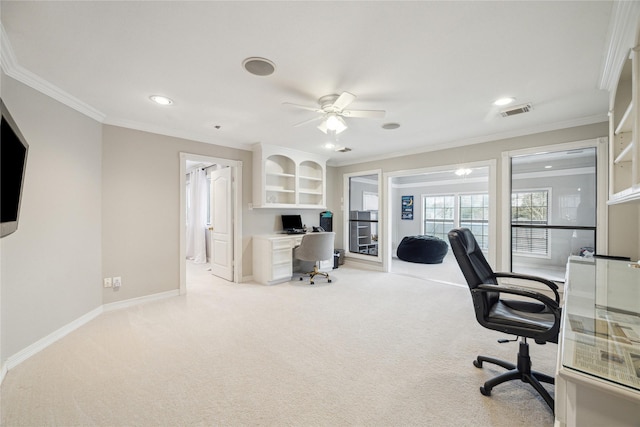 carpeted office featuring ceiling fan and crown molding