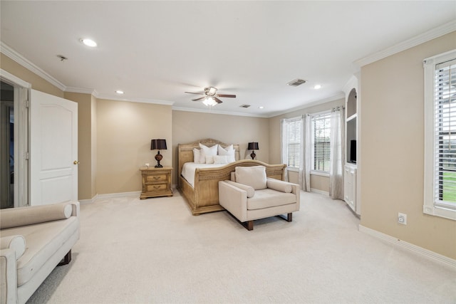 bedroom with ceiling fan, crown molding, and light colored carpet