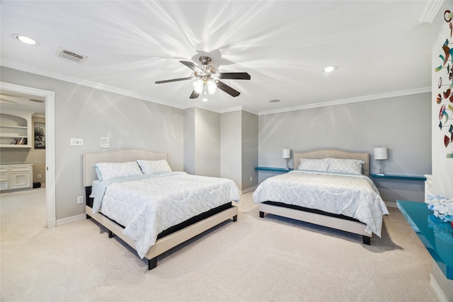 carpeted bedroom featuring ceiling fan and crown molding