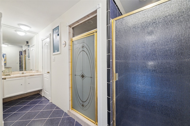 bathroom featuring vanity, tile patterned floors, and walk in shower