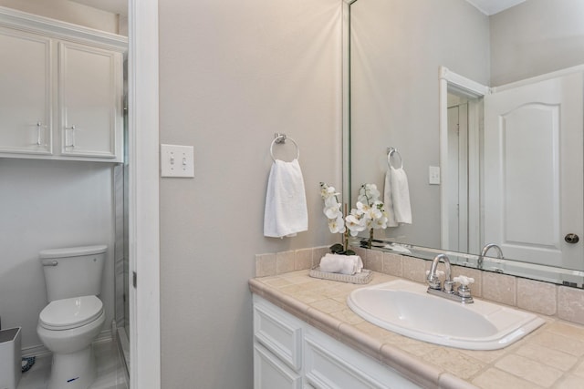 bathroom with toilet and vanity