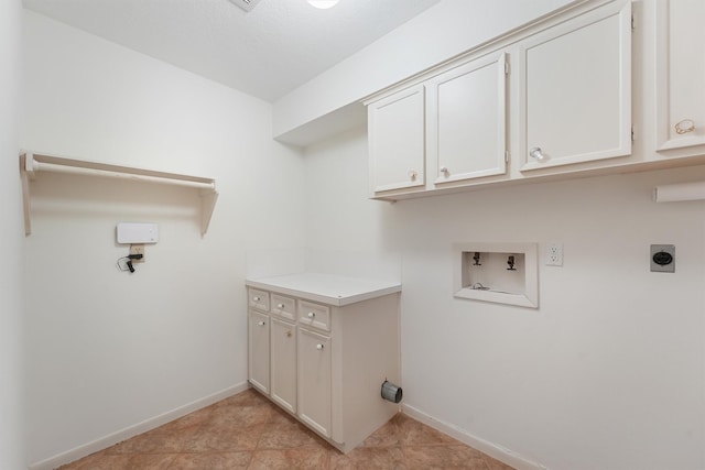 washroom with washer hookup, light tile patterned floors, cabinet space, hookup for an electric dryer, and baseboards