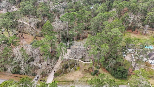 drone / aerial view featuring a forest view