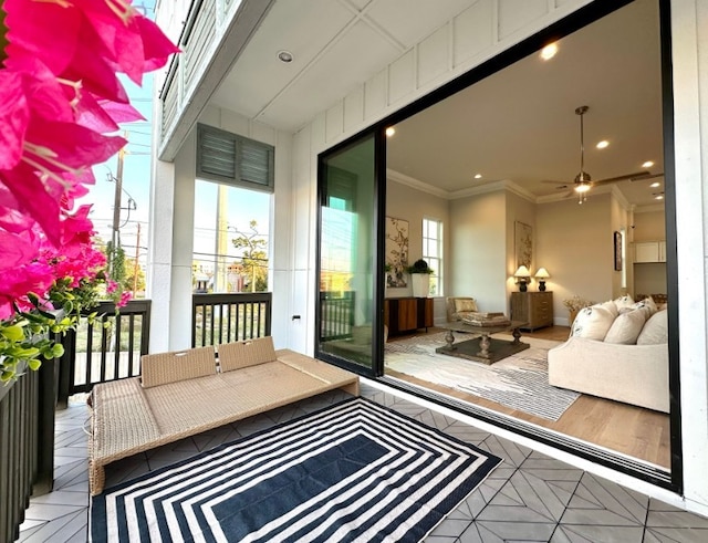 balcony featuring an outdoor living space and ceiling fan