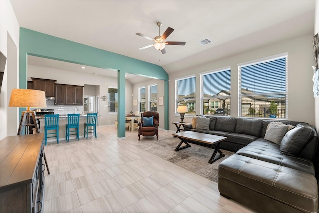 living area with visible vents and ceiling fan