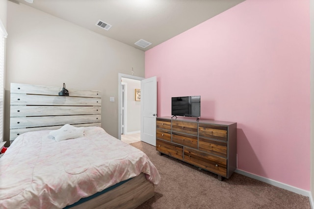 bedroom featuring light carpet, visible vents, and baseboards